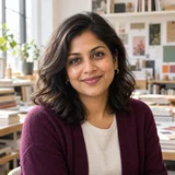 AI-generated portrait of Priya Nair, a fictional editorial designer