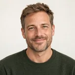 AI-generated portrait of Owen Reid, a fictional game narrative designer